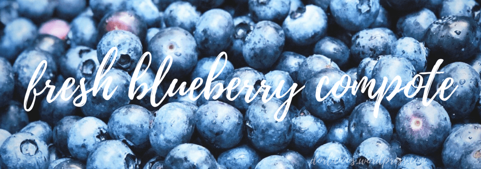 Blueberries with water droplets and white overlay text that reads "fresh blueberry compote"